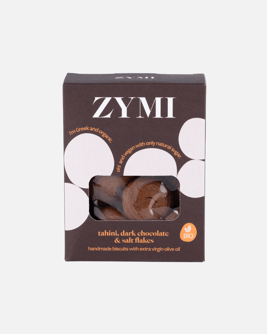 Schwarze Verpackung der Zymi Bio-Kekse mit Tahini, dunkler Schokolade und Salzflocken, handgemacht und vegan.